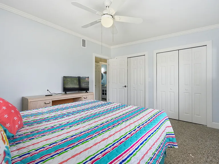 Bedroom #1 with Queen Bed and lots of closet space and 42 inch TV.