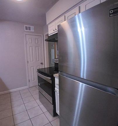Updated kitchen with stainless appliances and pantry closet