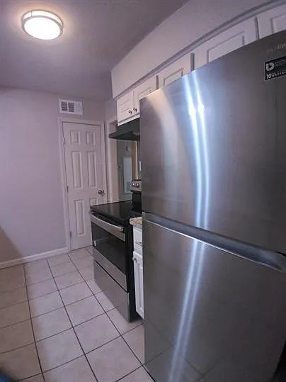 Updated kitchen with stainless appliances and pantry closet