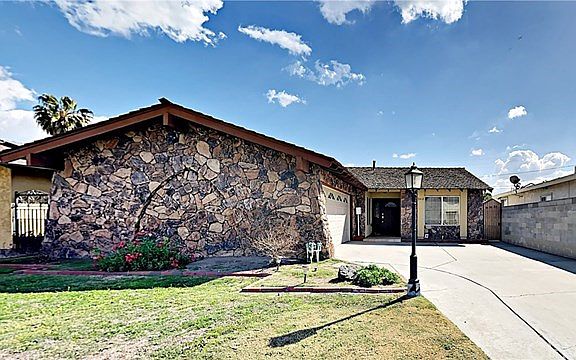 Long, Sweeping Driveway with 2 Car Garage