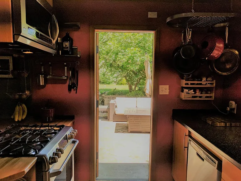 Dining area: Transom widows that open out to backyard