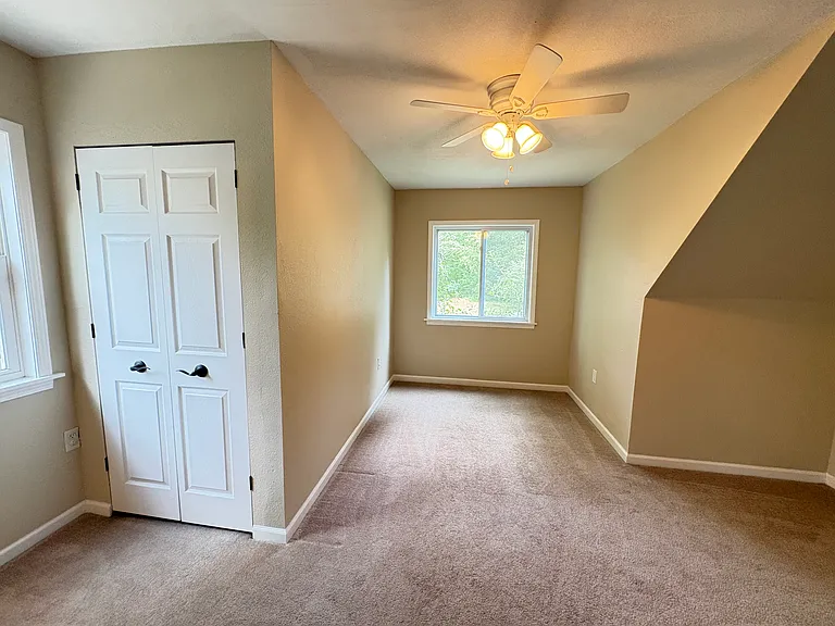 Versatile flex room connected to the third bedroom, ideal as a playroom, family room, or bonus living space.