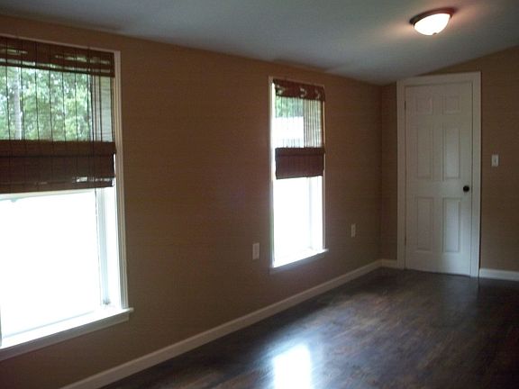 MASTER BEDROOM HAS WALK-IN CLOSET AND REFINISHED WOOD FLOORS