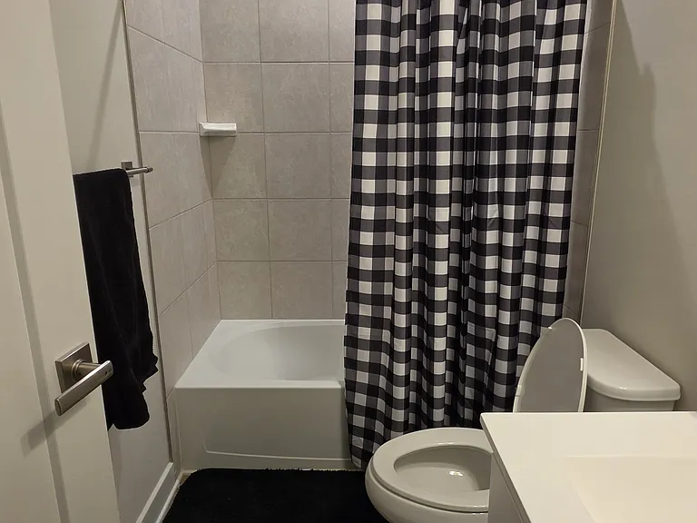 Third level shared bathroom and shower.
