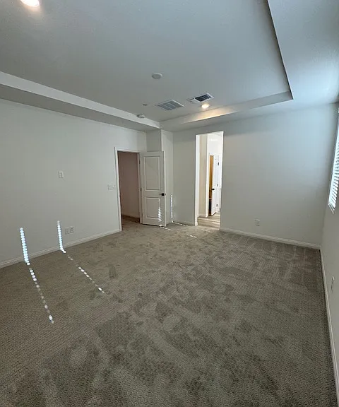 primary bedroom with 9' coffered ceiling- modern ceiling fan w/light installed