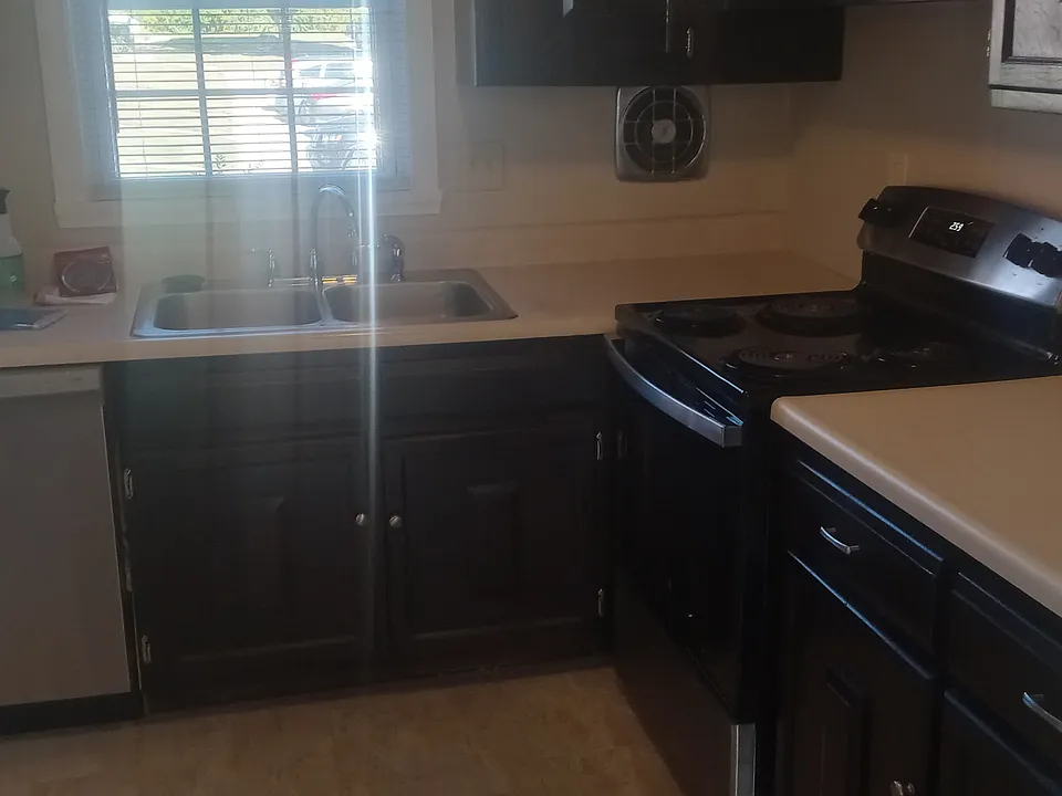 Fully appliance kitchen with newly tiled flooring and freshly painted recently.