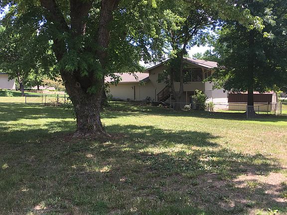 Partially fenced back yard. 