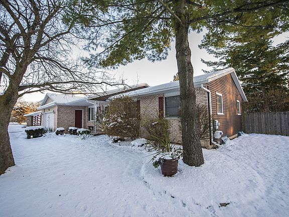 The front of the home features inviting landscaping with mature trees.  You'll also enjoy the privacy fence that wraps around the backyard.