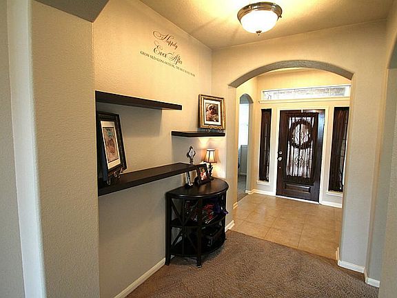 Inviting entrance with archways & rounded corners