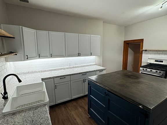 Large new kitchen island with cabinet doors with tons of storage!