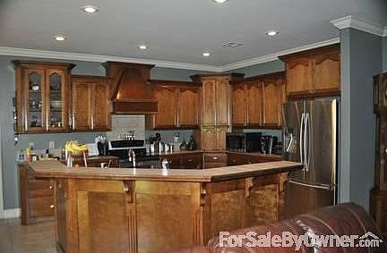 Kitchen
						:
						This kitchen has a ton of beautiful custom cabinets.