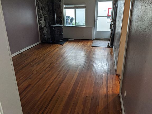 Refinished hardwood floors in the living room.