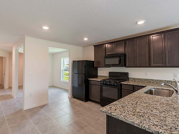 This move-in ready home features gorgeous granite countertops in the kitchen