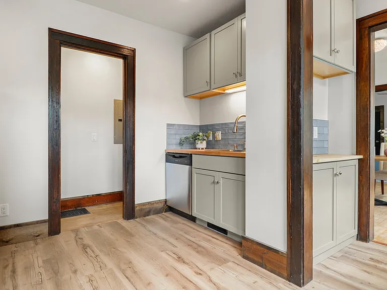 This is a shot showing the kitchen and downstairs butler's pantry leading into the dining room. We shot the upstairs with no furniture . Both units are almost exactly the same.