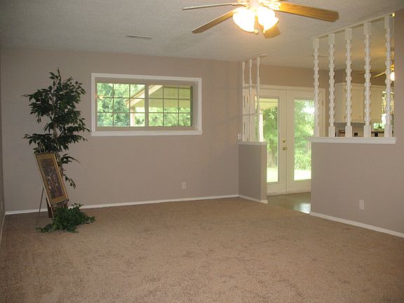 Living room is nice sized w/fan/light