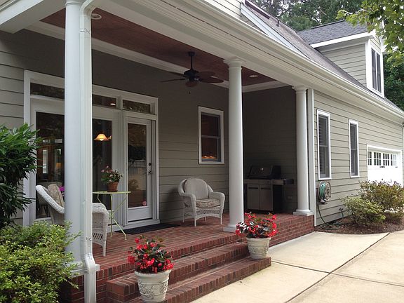 Side porch adjacent to drive