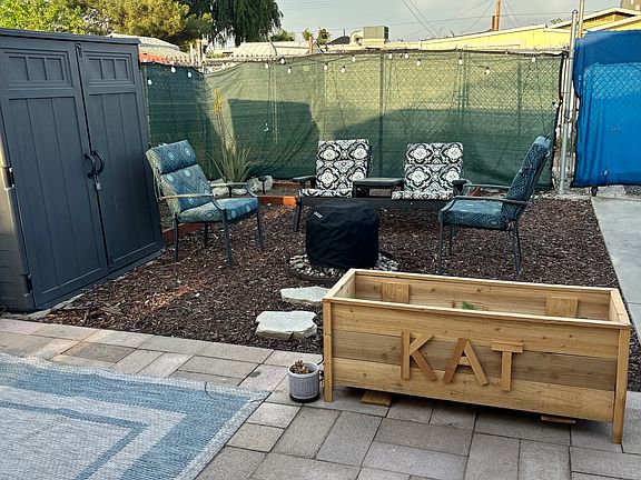 Spacious yard with two car parking space. Private access from alley. Mulched and drought tolerant landscape.