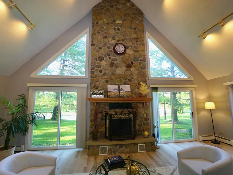 Great room with wood burning fireplace.