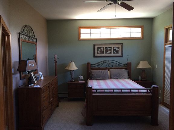 Master bedroom/master bathroom with large walk-in cedar closet. Your bed overlooks mountains and Continental Divide peaks.