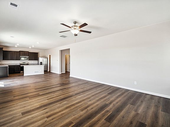 Spacious living room that opens up to the upgraded kitchen.