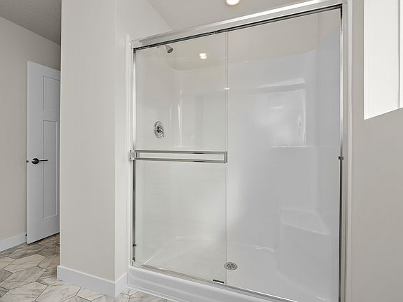 The master bedroom has a step in shower.
