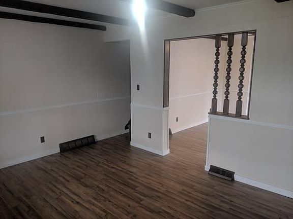 The living features wood beams, new hardwood flooring and fresh paint.