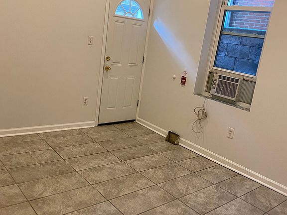 Large bedroom with access to rear yard