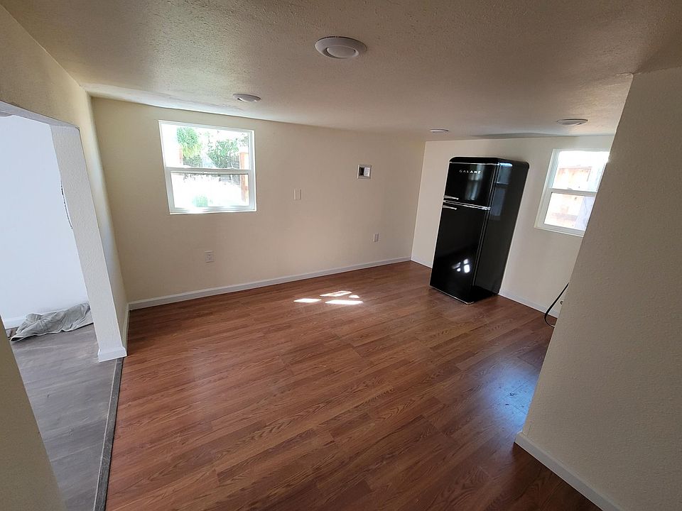 Living room with be groom opening on left