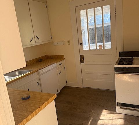 Fresh paint and flooring in kitchen.