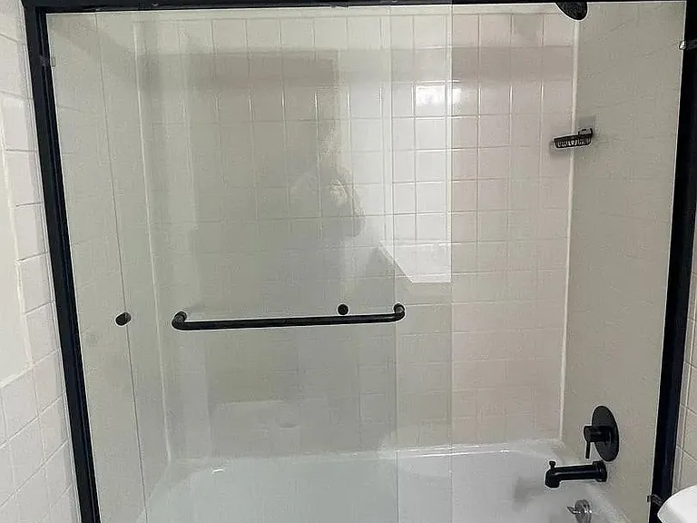 Revitalize your daily routine in this stylish bathroom featuring a sleek glass shower enclosure and modern fixtures. Enjoy a blend of comfort and elegance that enhances your lifestyle. Schedule a tour today to see it for yourself!