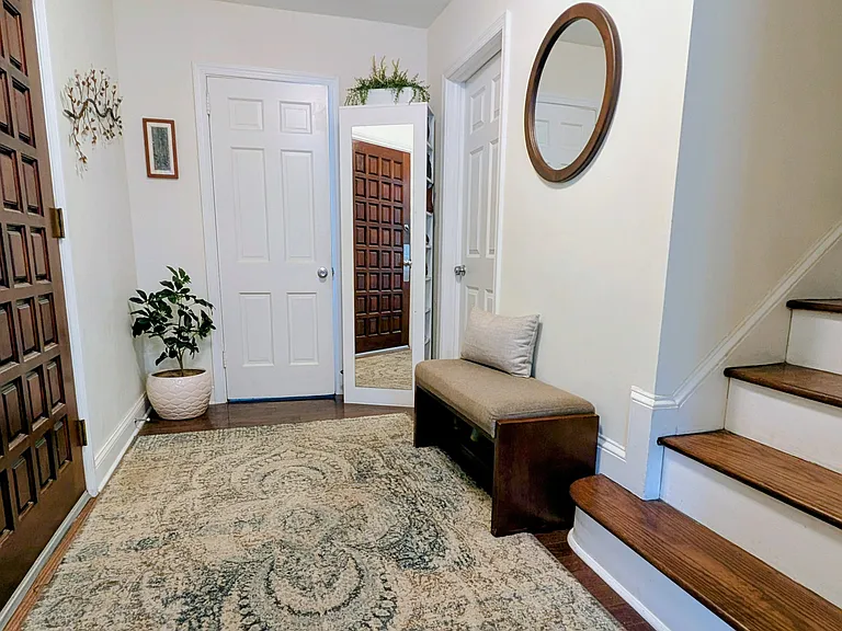 Foyer, with doors to half bath and mudroom/laundry on 1st floor