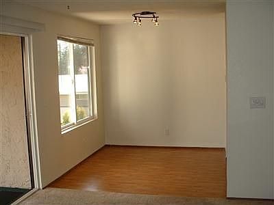 Dining room has new laminate flooring.