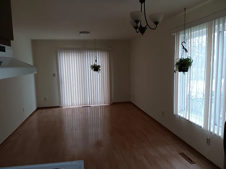 Large dining, LED lights, large windows with large private backyard and private garage access.