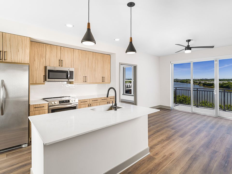 Enjoy culinary convenience at Modera Riverview with a spacious chef's island featuring built-in storage.