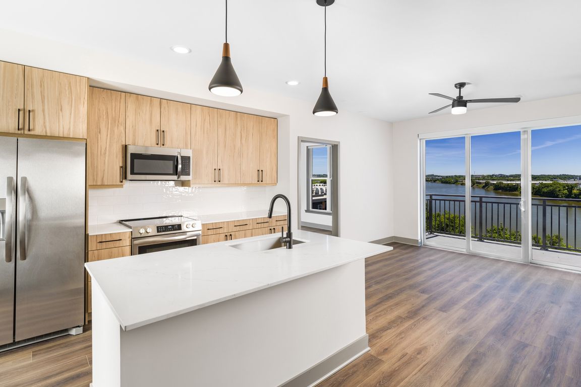 Enjoy culinary convenience at Modera Riverview with a spacious chef's island featuring built-in storage.