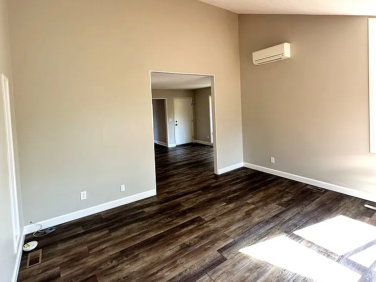 Additional living quarters with slider glass door leading to deck and overlooking backyard