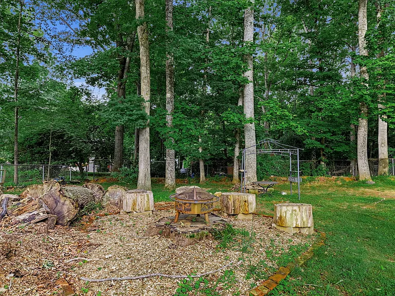 BACK YARD: Fire Pit and BBQ Gazebo and Table (Additional Seating areas to right)