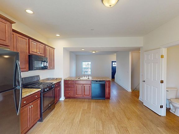 Kitchen area with half bathroom on first floor
