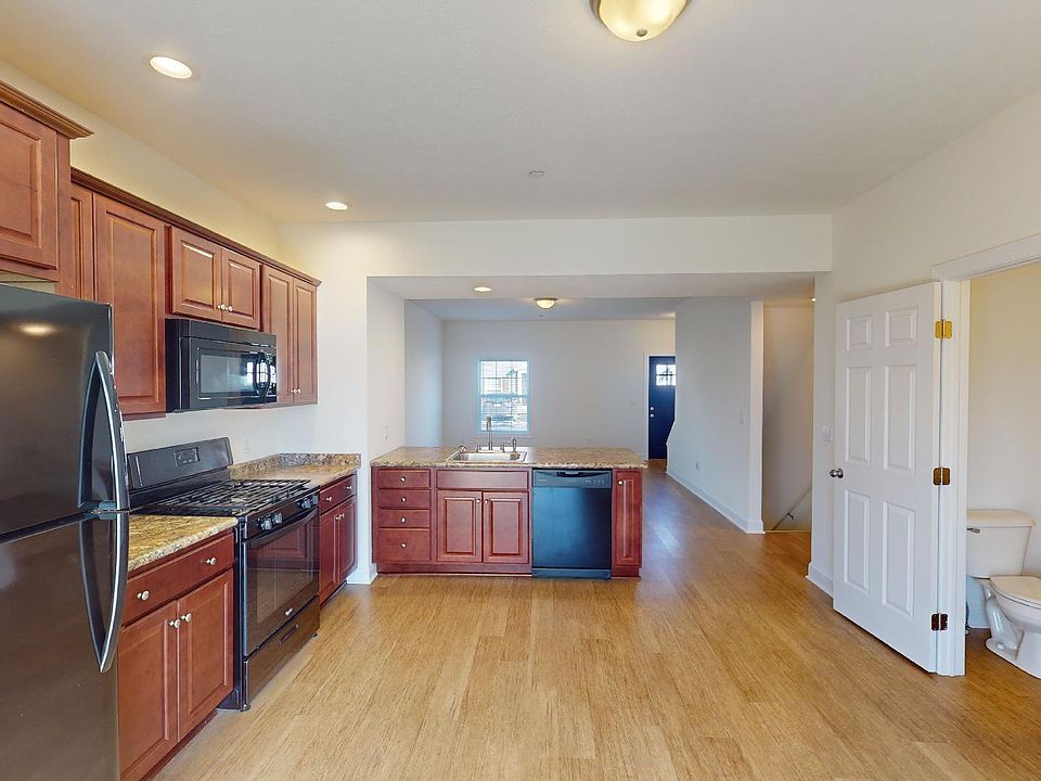 Kitchen area with half bathroom on first floor