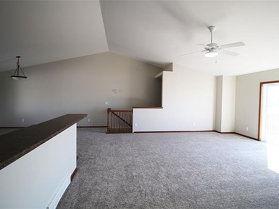 Vaulted Great Room is open to the kit & eating area