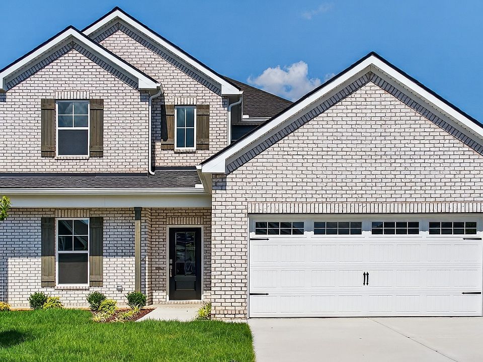 Exquisite two-story brick architecture in McClure Farms, Oakland with stylish gabled roof and dark s