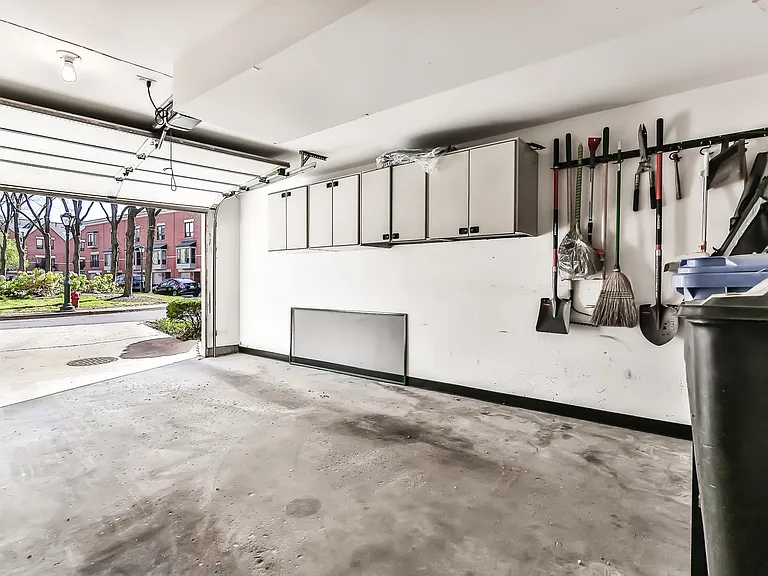 Ample garage that can fit even a large SUV & attached parking pad