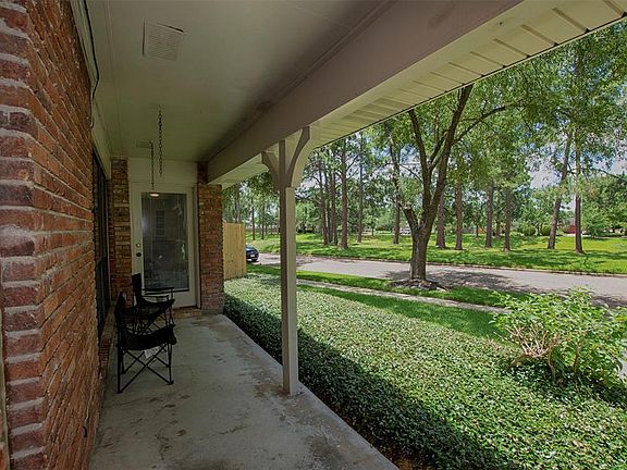 There is lovely front garden with views of the Greenbelt. There is a secondary door to the Sun Room.