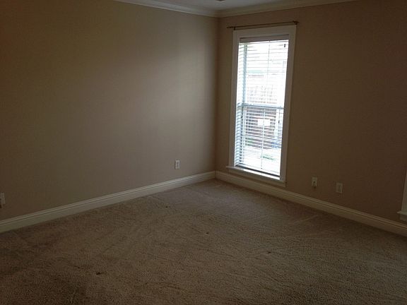 Foyer - View 2
						:
						Beautiful display shelves and storage cabinets flank one side of the foyer.