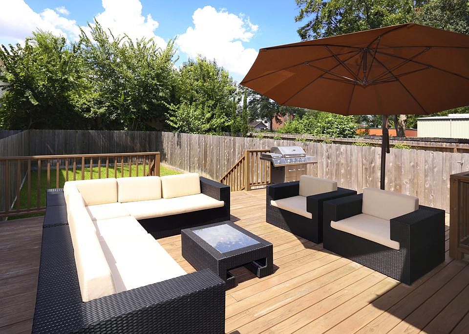 Absolutely stunning view of the expansive and welcoming backyard playing host to multiple areas for 