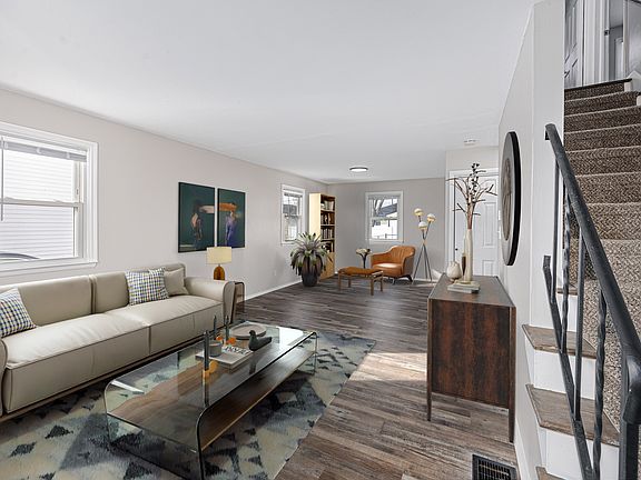 Living area shown as staged and furnishings not available