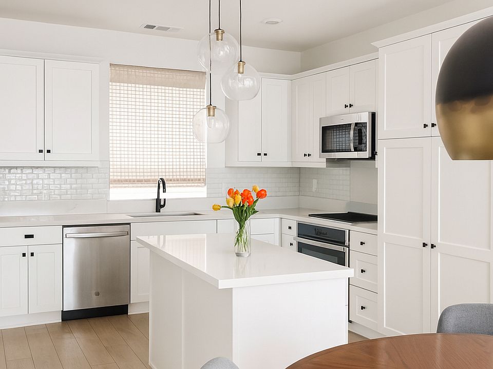 Beautiful quartz countertop kitchen comes with refrigerator.