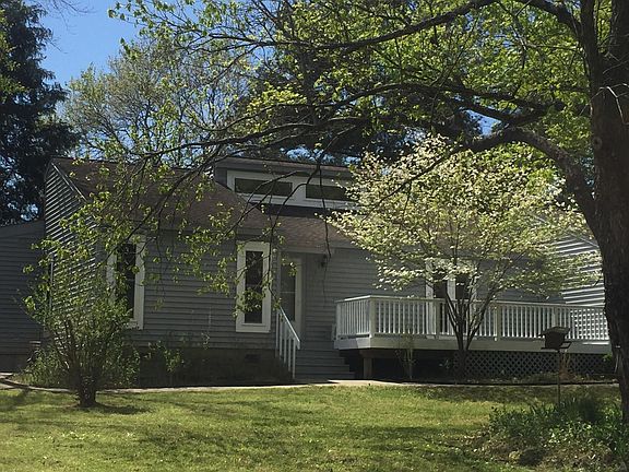 Front entrance and large deck overlooking the mature yard