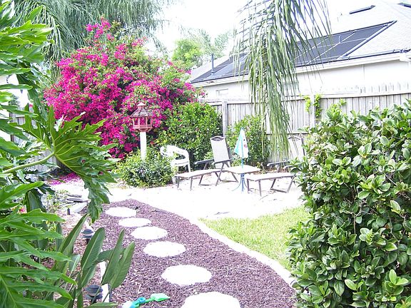 Fenced back yard and screened lanai