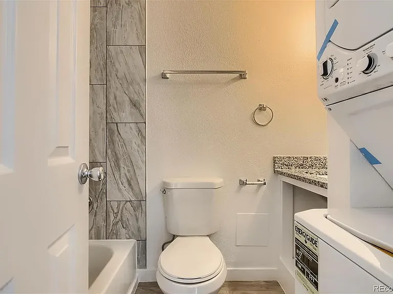 In-unit washer dryer located in second bath